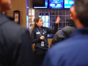 Tour guide at Madison Square Gardens giving a lively tour of the arena.